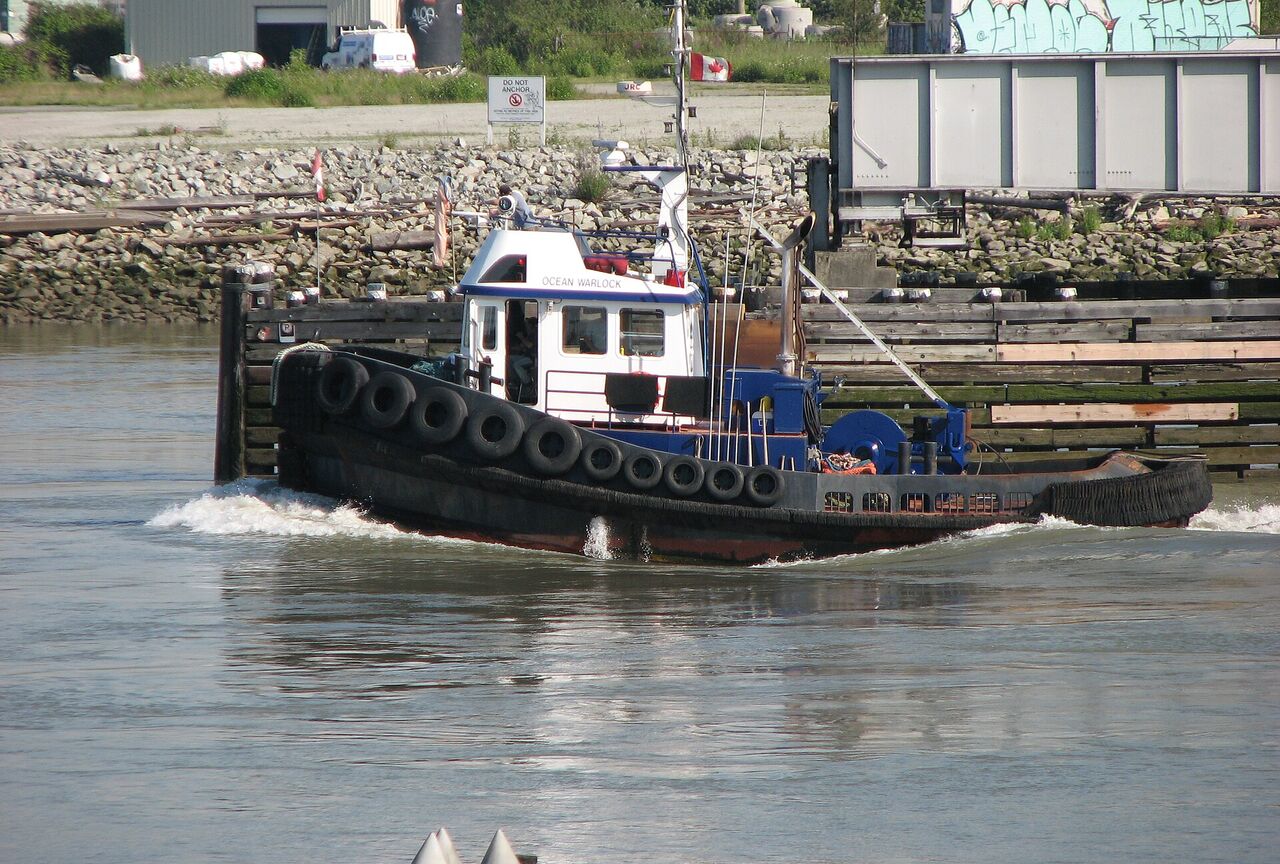 Tugboat passing the River Rock boardwalk